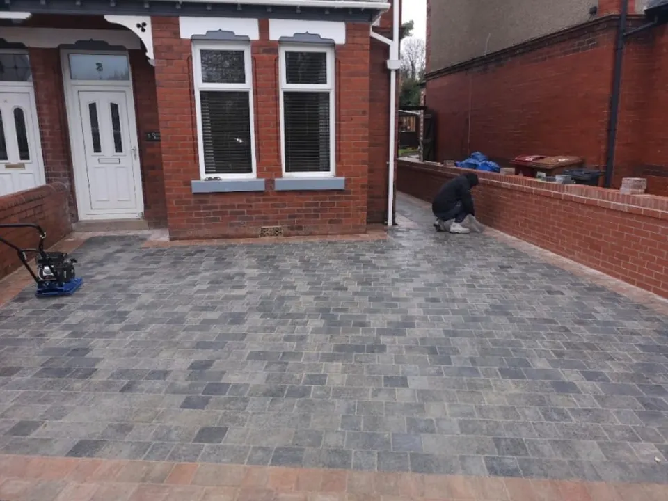 Charcoal block paved driveway with a contrast border
