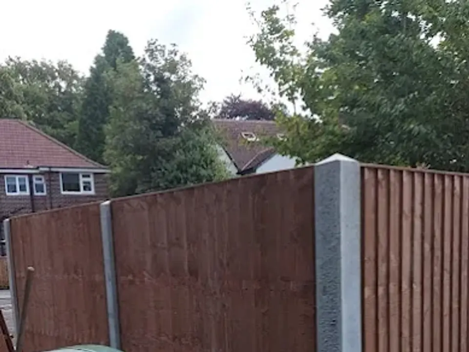 Close board fencing with concrete posts and gravel boards
