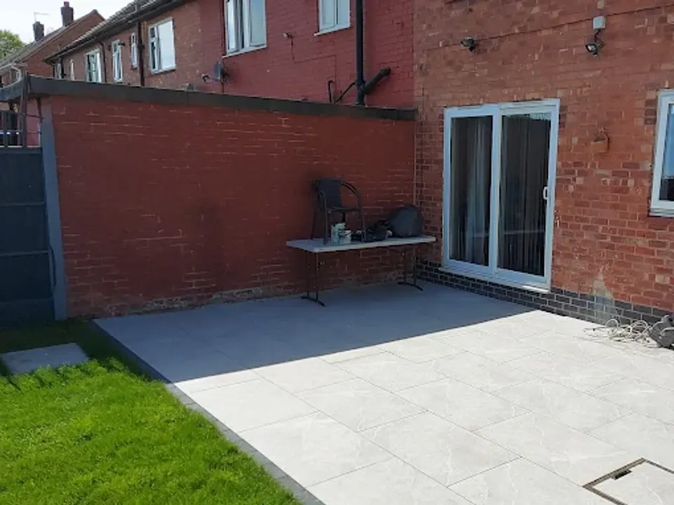Porcelain patio laid up to the patio doors