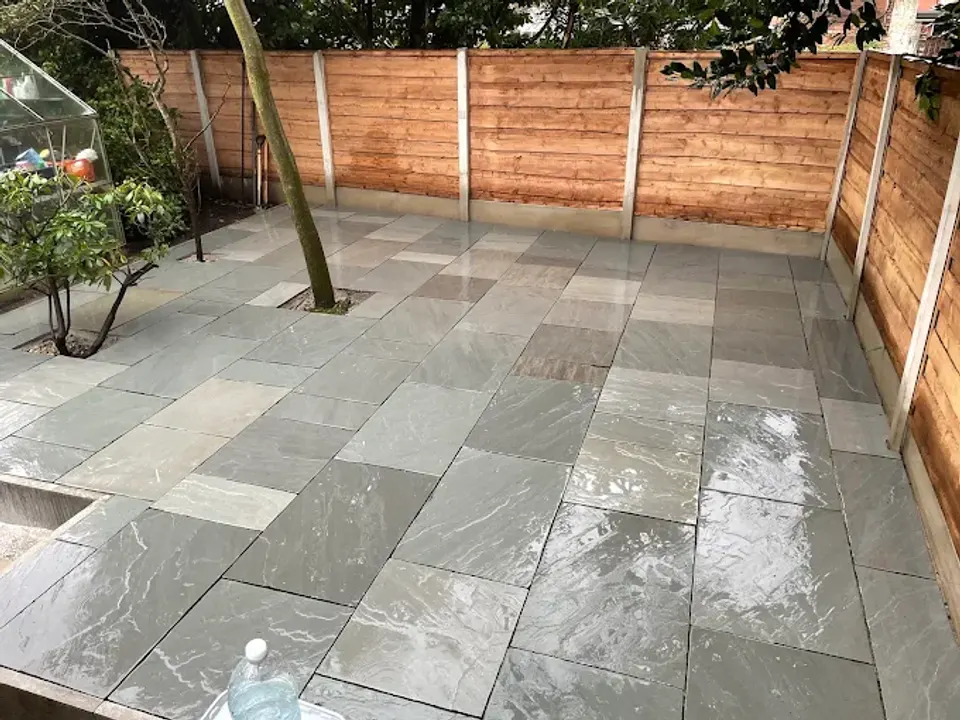 Porcelain patio with a new timber fence behind