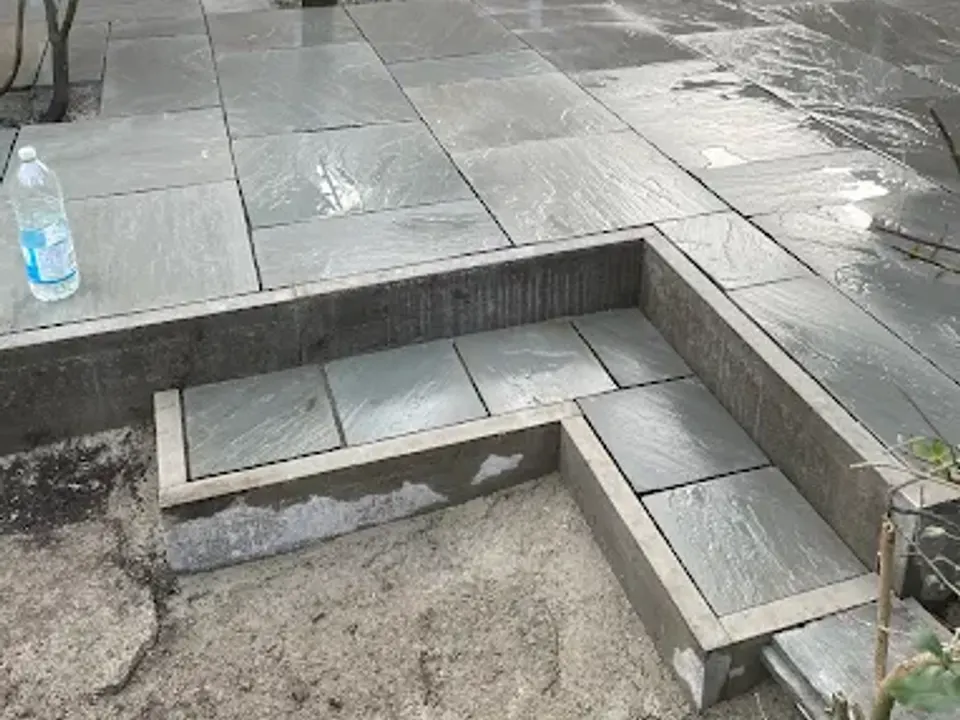 Dark porcelain patio with wide steps