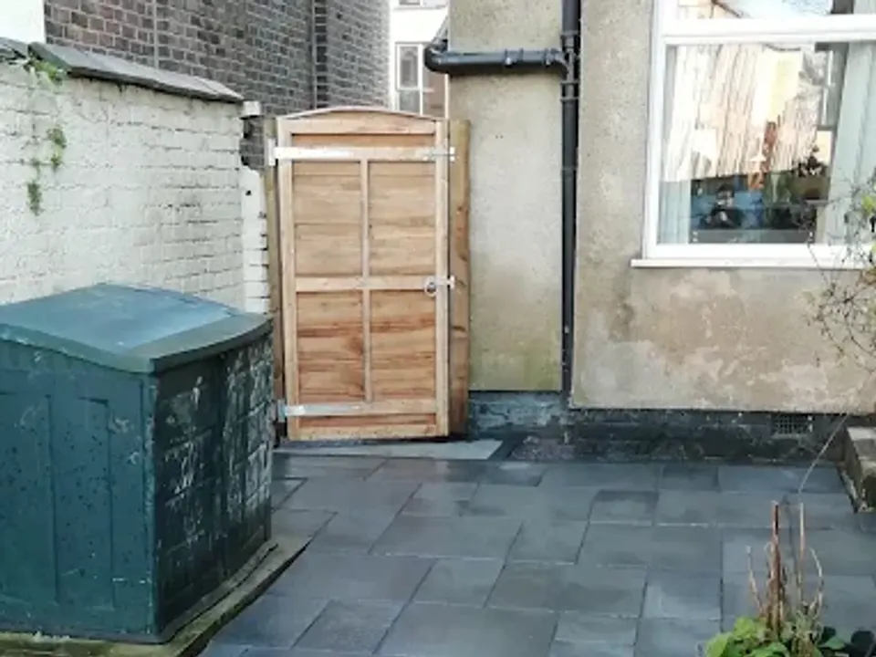 Slate patio with planting borders