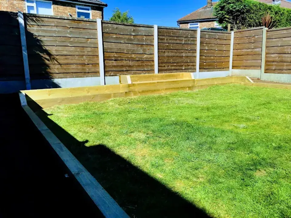 Sleeper edged lawn with new fencing