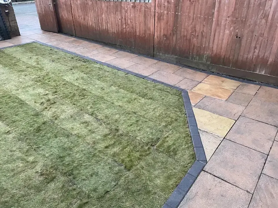 Fresh turf with a block paved border